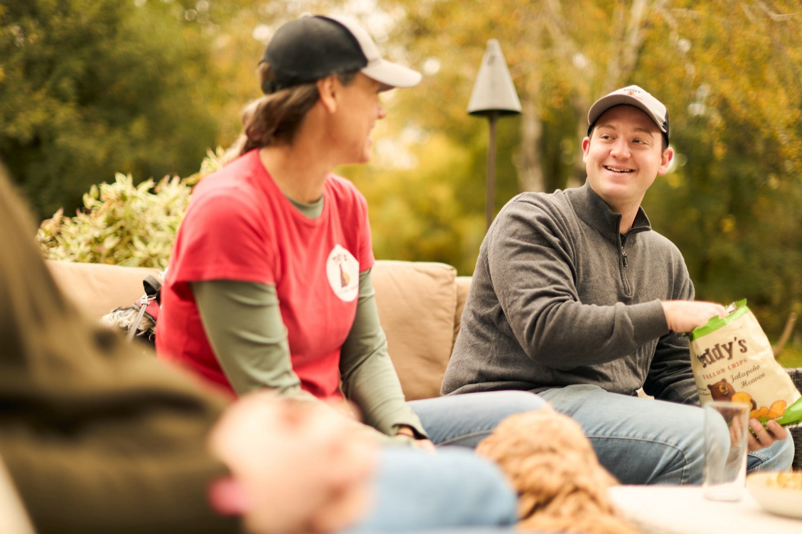 Teddy's chips being shared outdoors
